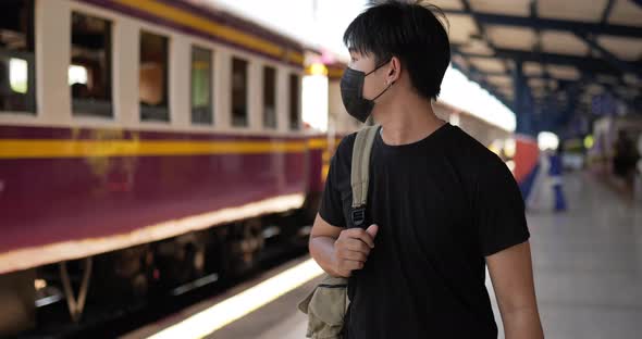 Man walking and looking the train alt