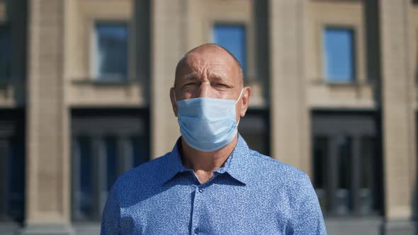 Elderly Man Look Camera, People Wearing Mask, They Believe in Covid-19. Portrait alt