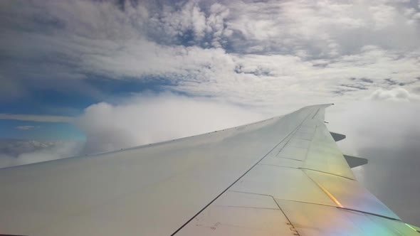 Airplane Wing through several cloud layers
