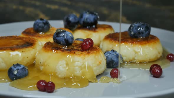 Honey Flows on Cottage Cheese Pancakes with Blueberries and Lingonberries