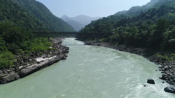 The Ganges river close to Rishikesh state of Uttarakhand in India from the sky alt