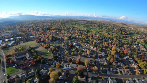 Aerial Flying Above Autumn Colorful Trees In City Of Medford Oregon Usa alt