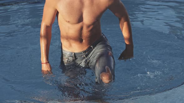Man In Jeans Leaving Swimming Pool alt