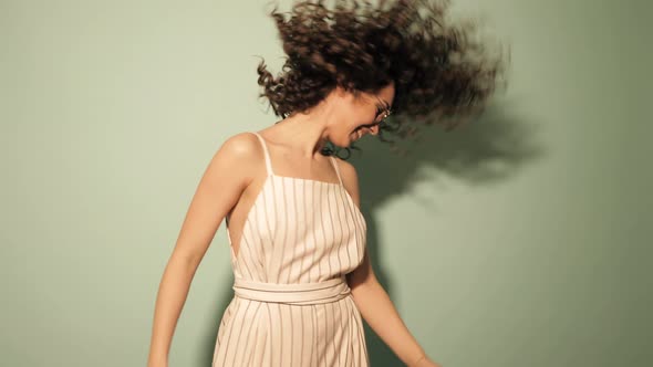 Beautiful smiling model with afro curls hairstyle dressed in summer hipster clothes alt