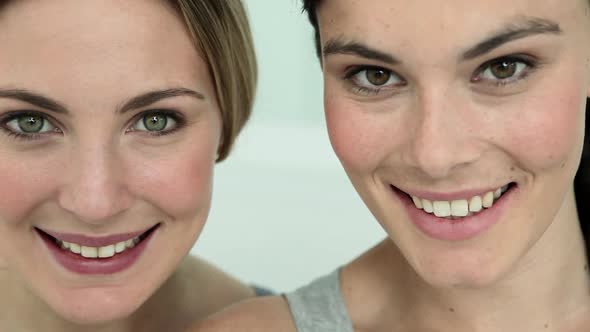 Two Young Woman Laughing, Close Up alt