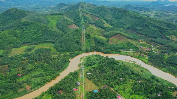 4K : Aerial view over farmland and hill farming alt