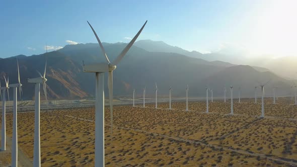 Dynamic Aerial Near Death Drone Shot Of Wind Farm