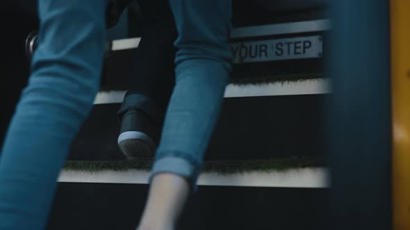 Diverse Children Legs Boarding Schoolbus Closeup alt