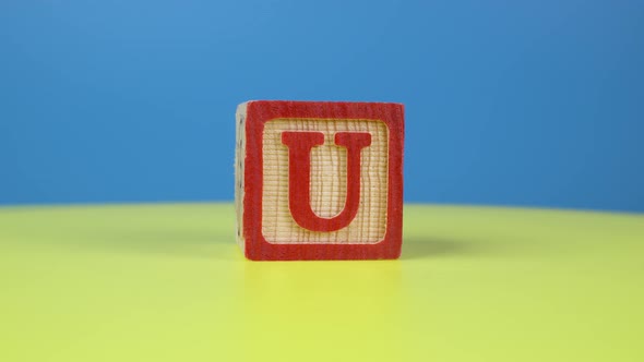 Close up shot letter "U" alphabet wooden block alt