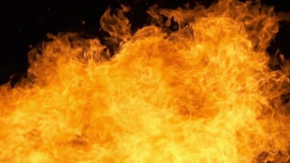 Fire Flames on a Black Background in Slow Motion Bonfire Burning at Night alt