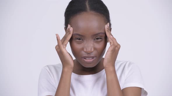 Young Stressed African Woman Having Headache alt