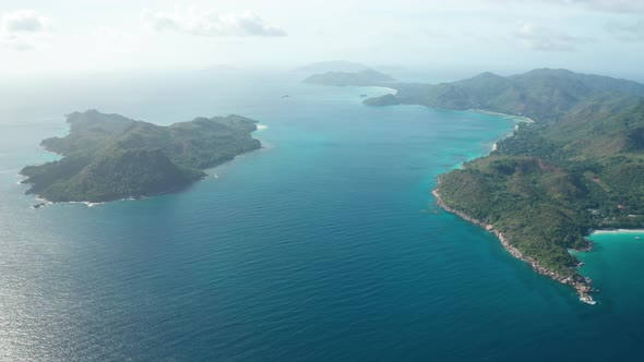 Aerial dolly at high altitude over Seychelles near Curieuse Island alt