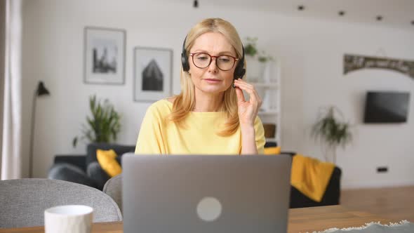 Woman Talking Into Microphone and Typing on the Keyboard Checks and Marks alt