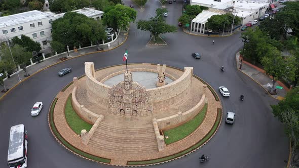 Slow aerial orbit to left showing the Monument a la Patria, Homeland Monument on the Paseo de Montej alt