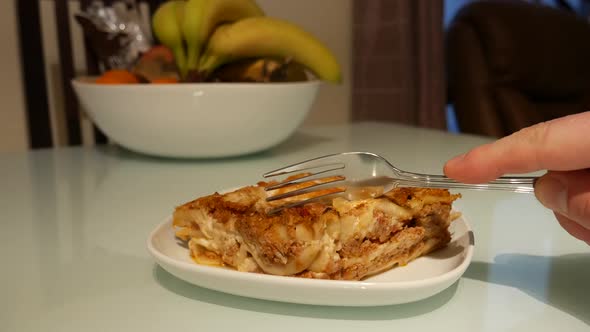 eating delicious lasagna alt
