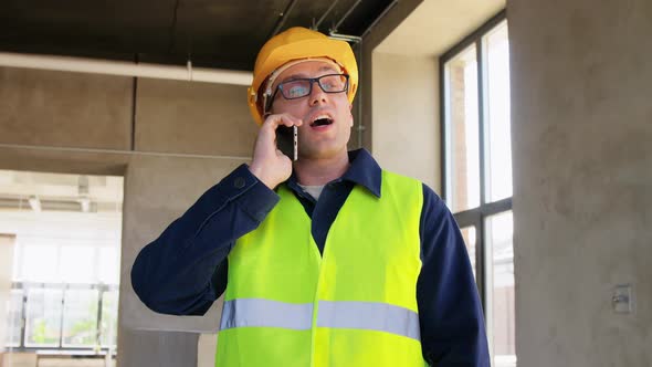 Angry Builder Calling on Smartphone at Office