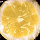 Super Slow Motion of Falling Water Drop on Lemon Slice - VideoHive Item for Sale