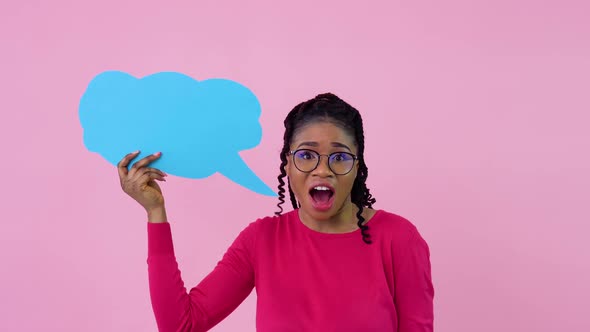 African American Girl in Pink Clothes Stands with Posters for Expression on a Solid Pink Background alt