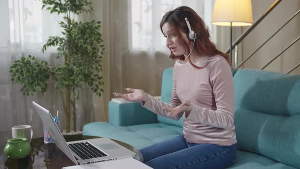 Smiling Girl Student Wear Headphone Study Online With Internet Teacher alt