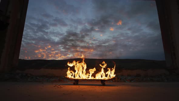 Evening view of a burning skateboard alt