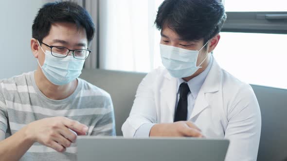 Asian doctor encouragement and supportive to cansor patient after consult