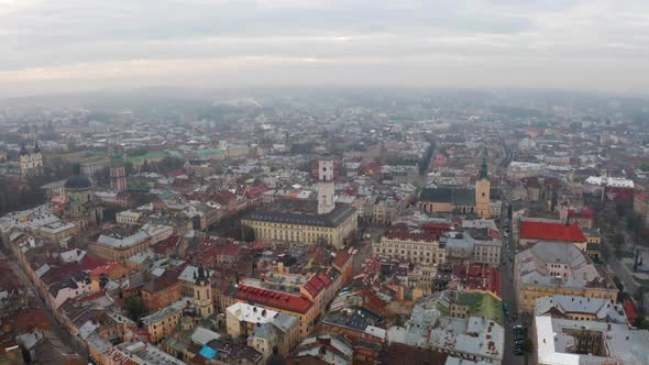 Flight Above the Roofs on Sunrise. Old European City. Ukraine Lviv City alt