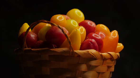 Farmer wicker basket with delicious tomatoes and peppers