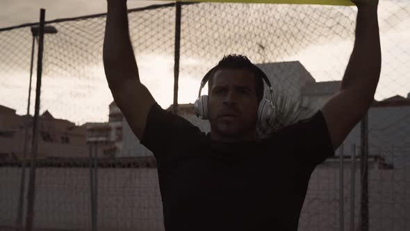 Latin man doing workout exercises session - Young Hispanic male training hard alt