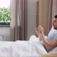 Happy Man with Smartphone in Bed at Home - VideoHive Item for Sale