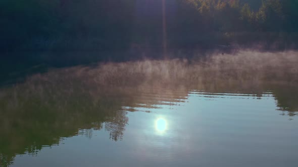  the Water Evaporates and Floats Above the Water in the Morning Sun.