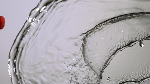 Water splash with fruit in ultra slow motion  alt