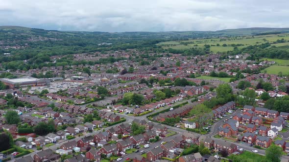 Aerial footage over a housing estate in Bolton, England alt