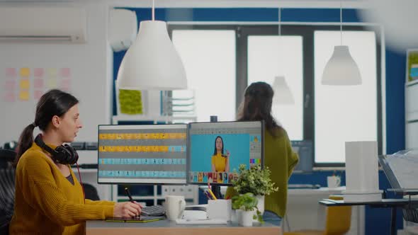 Photo Editor Specialist Working on Computer in Creative Office Environment alt