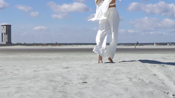 Beautiful Woman Walking on Shore