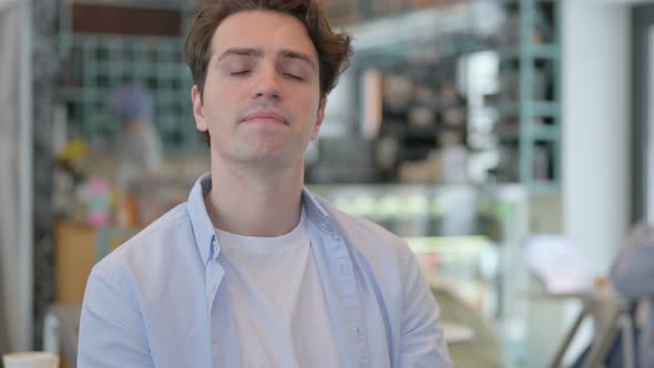 Portrait of Young Man Waiting and Checking Watch alt