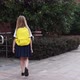 Happy Little Caucasian Blonde Girl Seven Years Old in Uniform with Yellow Backpack Going Back to - VideoHive Item for Sale