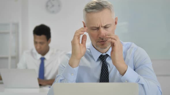 Headache Upset Grey Hair Businessman in Stress at Work alt