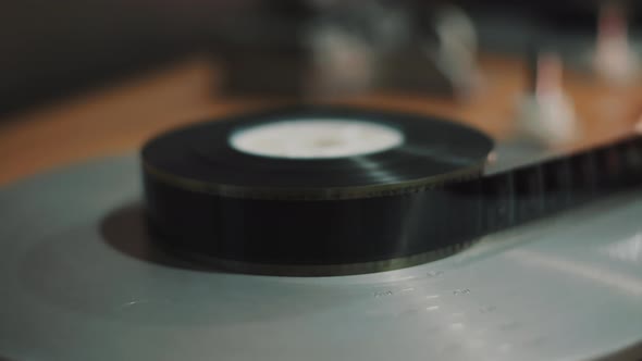 A film strip is wound on a roll alt