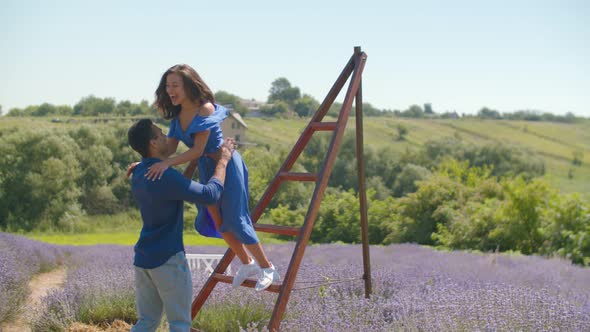 Excited Mixed Race Couple Enjoys Leisure in Nature alt
