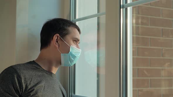 Sick Man in Medical Mask Is on Self-isolation