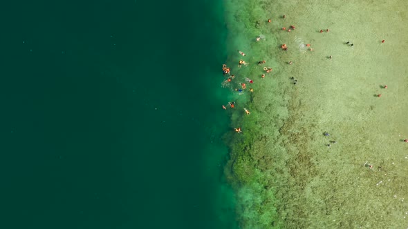 Tourists Snorkeling in the Lagoon Philippines El Nido alt