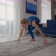 Young Woman is Practising Yoga at Home Relaxing in Simple Body Position Sitting on Floor with - VideoHive Item for Sale