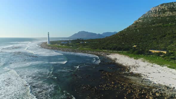 Wide Aerial Shot Tracking in Towards a Lighthouse with a Mountainous Backdrop