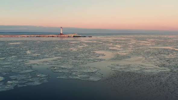Frozen Baltic sea coastline, sunset aerial view over Gulf of Riga alt