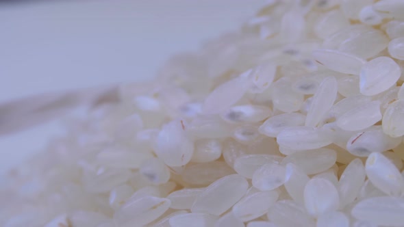 Grains of Raw Rice Rotate Close-up alt