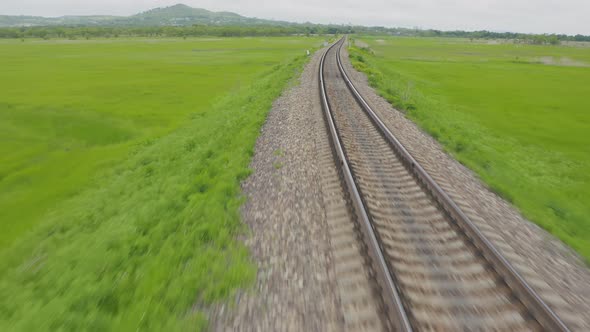 Empty Straight Oneway Railways on a Summer Sunny Day alt
