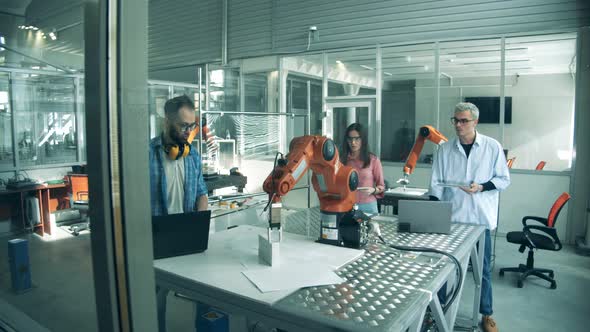 Science Workers are Conducting an Experiment with Bionic Devices alt