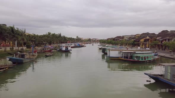Hoi An River Landscape City Channel with Moored Boats alt