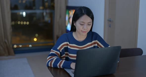 Woman work on computer at home alt