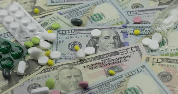 Pills Falling on Dollar Banknotes, Expensive Medication, Pharmaceutical Business alt